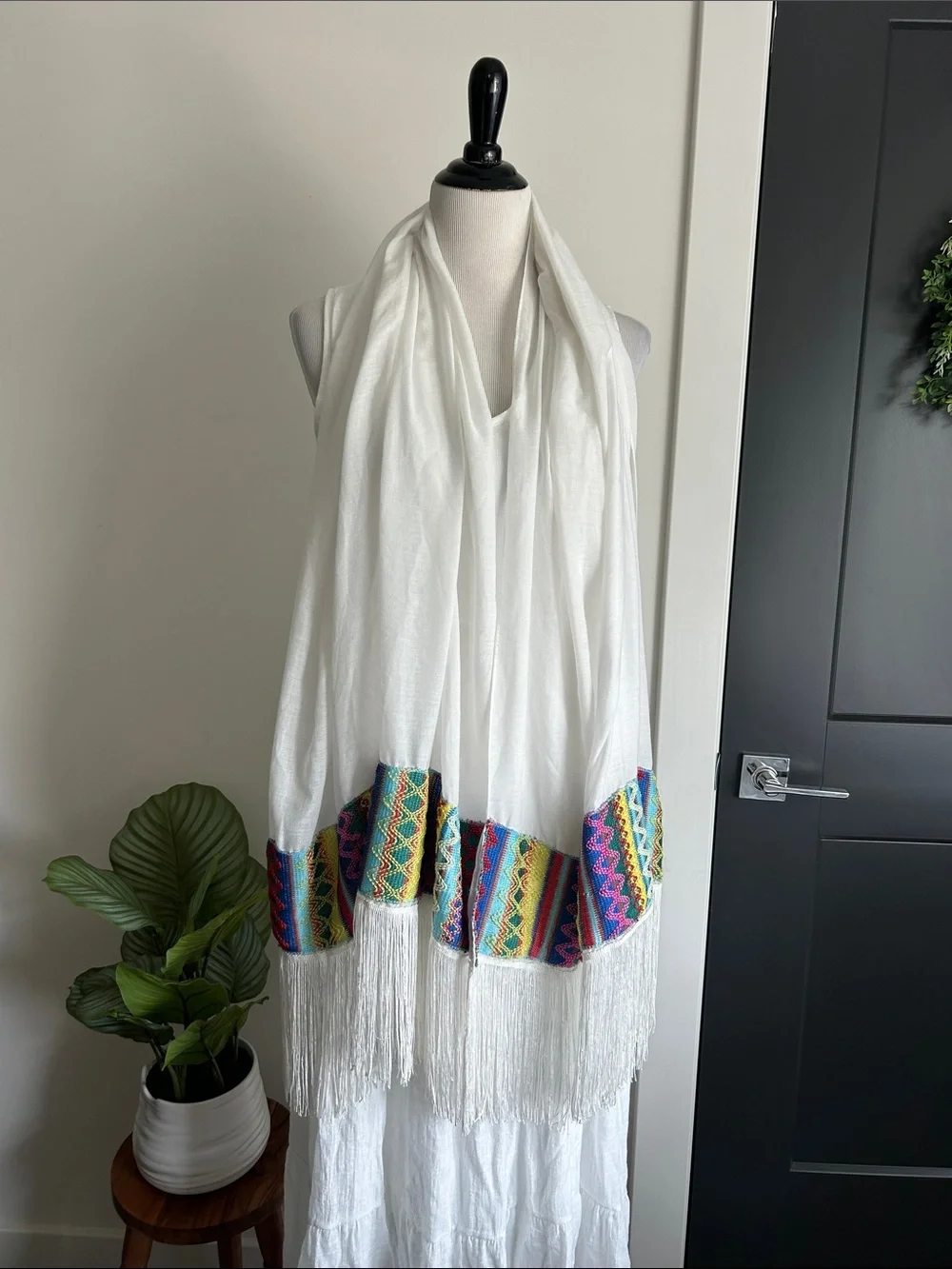 World Market white fringe scarf with red blue yellow green stitching